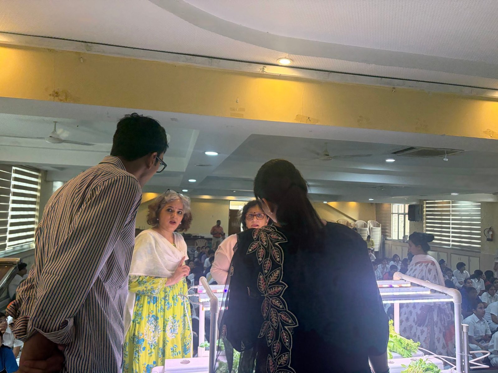 DPS Faridabad teachers looking closely at the hydroponic demo systems after the session